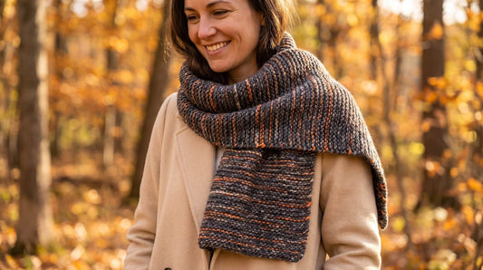 How to knit a scarf hero styling shot of the finished Journey Scarf in Andean Spirit Charcoal Orange Cloudtouch Baby Alpaca Pima Cotton Blend worn wrapped once with fall outfit