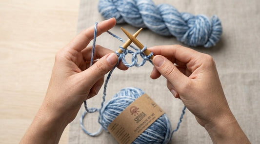 Beginner knitter hands holding bamboo needles with Cloudtouch Baby Alpaca Pima Cotton Blend yarn casting on a first scarf project