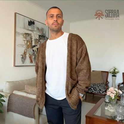Man wearing Nomad Cardigan Knitting Kit in Brown Baby Alpaca Pima Cotton Cloudtouch Blend