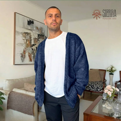 Man wearing Nomad Cardigan Knitting Kit in Indigo Baby Alpaca Pima Cotton Cloudtouch Blend