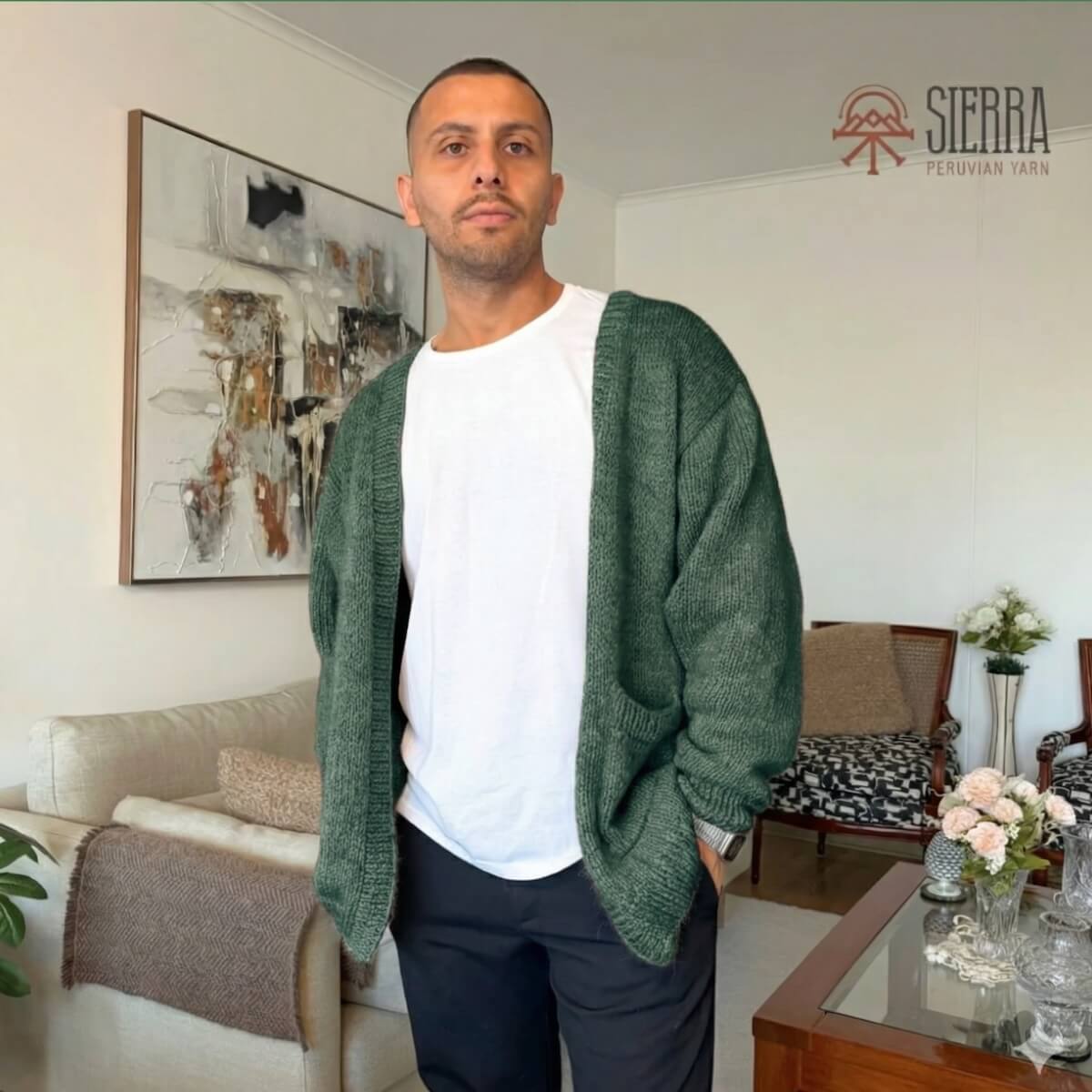 Man wearing Nomad Cardigan Knitting Kit in Jungle Green Baby Alpaca Pima Cotton Cloudtouch Blend